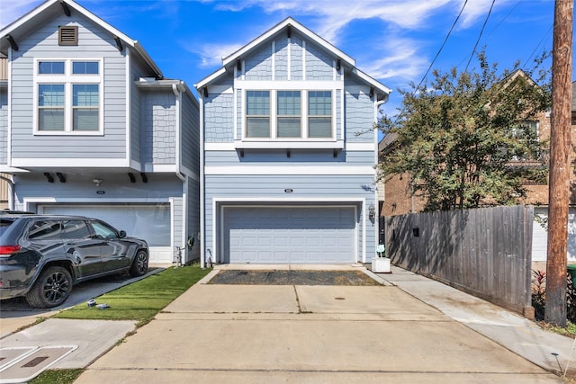 5432 Nolda St, Houston, TX 77007 - multi unit property featuring concrete driveway, an attached garage, and fence
