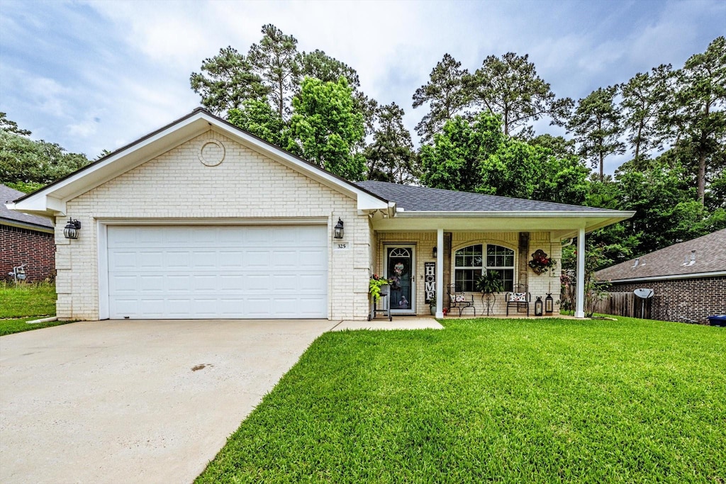 325 Green Leaf St, Huntsville, TX 77340 - ranch-style house with a garage, a front lawn, concrete driveway, a porch, and brick siding
