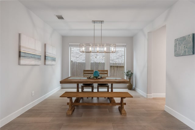 318 Mistletoe Ridge Ct, Montgomery, TX 77316 - dining area featuring baseboards, visible vents, and wood finished floors