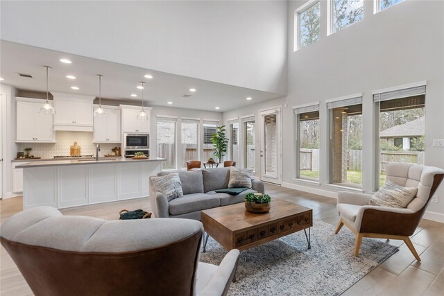 318 Mistletoe Ridge Ct, Montgomery, TX 77316 - living room with a towering ceiling, visible vents, and recessed lighting