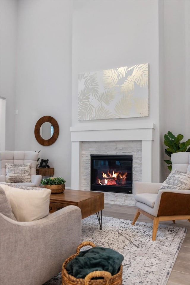 318 Mistletoe Ridge Ct, Montgomery, TX 77316 - living room with a glass covered fireplace, a towering ceiling, and wood finished floors