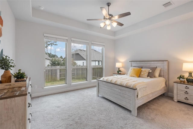 318 Mistletoe Ridge Ct, Montgomery, TX 77316 - bedroom with light colored carpet, a raised ceiling, a ceiling fan, and visible vents
