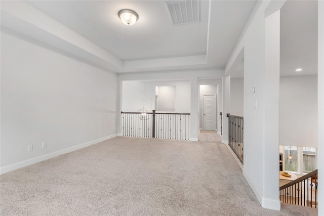 318 Mistletoe Ridge Ct, Montgomery, TX 77316 - carpeted spare room featuring visible vents, baseboards, and a raised ceiling