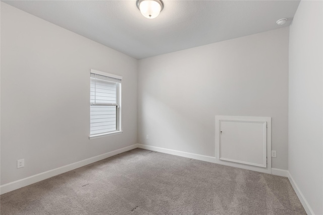 318 Mistletoe Ridge Ct, Montgomery, TX 77316 - carpeted spare room with baseboards