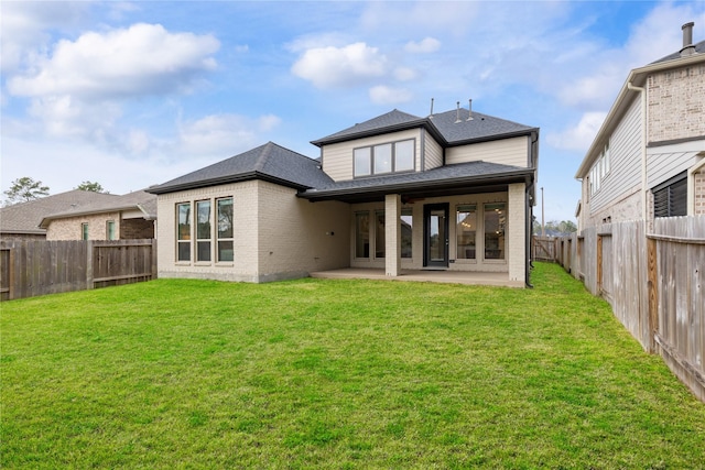 318 Mistletoe Ridge Ct, Montgomery, TX 77316 - rear view of property with brick siding, a lawn, a fenced backyard, and a patio