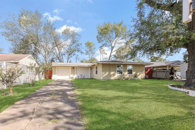 ranch-style home featuring driveway, a garage, fence, and a front yard
