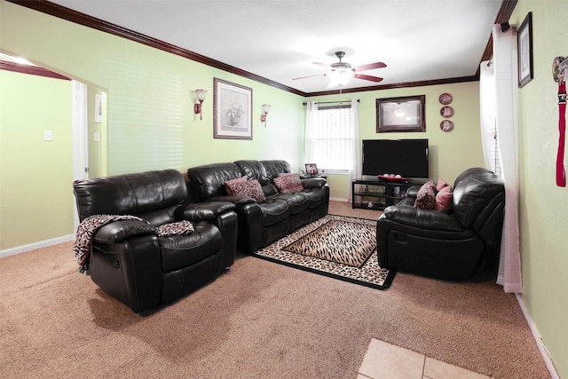 carpeted living area featuring baseboards, ceiling fan, and crown molding