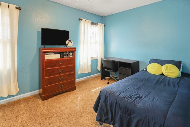 carpeted bedroom with baseboards