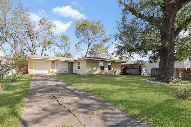 ranch-style house with a front lawn, driveway, a garage, and fence