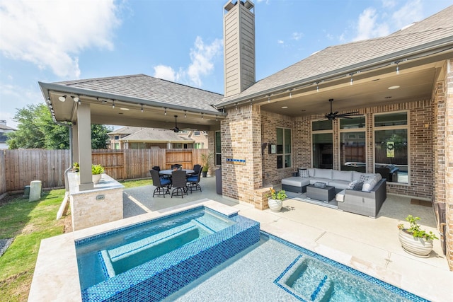 view of swimming pool with ceiling fan, a fenced backyard, outdoor lounge area, a patio area, and outdoor dining space