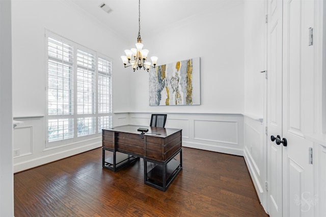 office featuring ornamental molding, a chandelier, a decorative wall, dark wood-style flooring, and a wainscoted wall