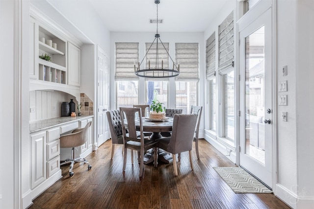 dining room with dark wood-style floors and baseboards