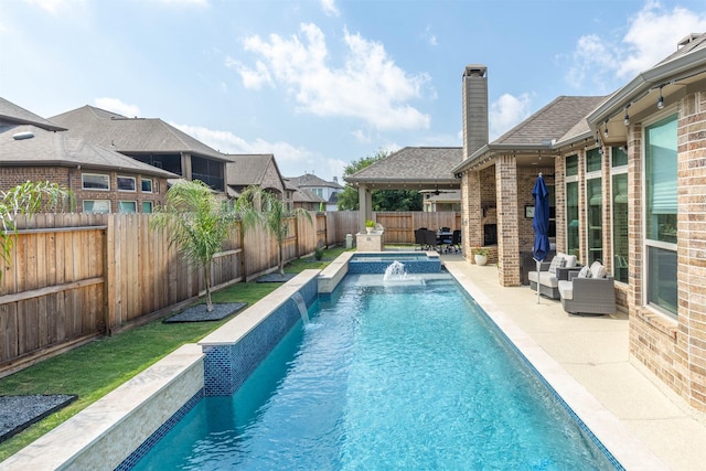 view of swimming pool featuring a fenced backyard and a patio area