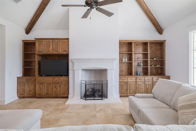 508 Golden Bear Dr, Austin, TX 78738 - living room with beam ceiling, high vaulted ceiling, a fireplace with raised hearth, a ceiling fan, and light tile patterned floors