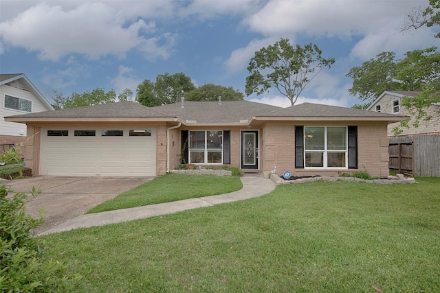 ranch-style house with fence, brick siding, concrete driveway, a garage, and a front lawn