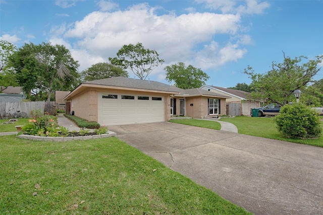 single story home with fence, brick siding, concrete driveway, a garage, and a front yard