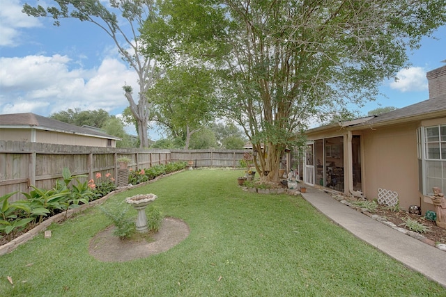 view of yard featuring a fenced backyard