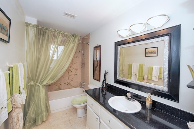 full bathroom with toilet, shower / bath combo with shower curtain, vanity, visible vents, and tile patterned floors
