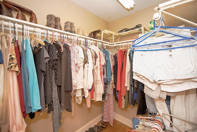 spacious closet with wood finished floors