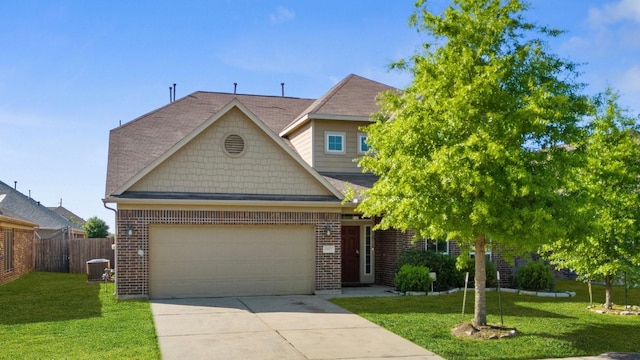 1902 Red Cedar Trl, Rosenberg, TX 77471 - view of front facade featuring driveway, brick siding, a front yard, and fence