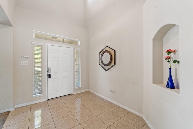1902 Red Cedar Trl, Rosenberg, TX 77471 - foyer entrance with light tile patterned flooring and baseboards