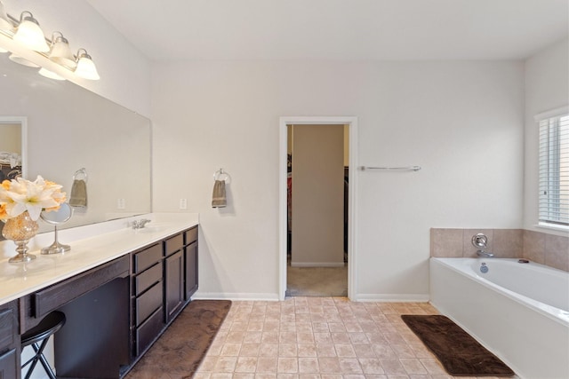 1902 Red Cedar Trl, Rosenberg, TX 77471 - full bathroom featuring baseboards, a spacious closet, vanity, and a bath