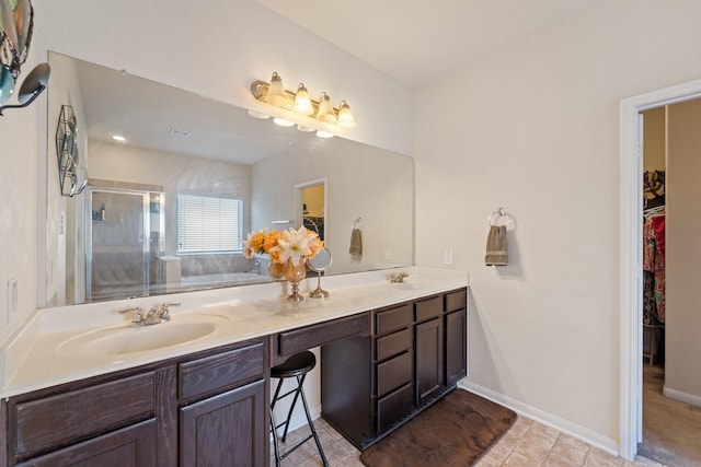 1902 Red Cedar Trl, Rosenberg, TX 77471 - bathroom with a shower stall, a sink, and a walk in closet