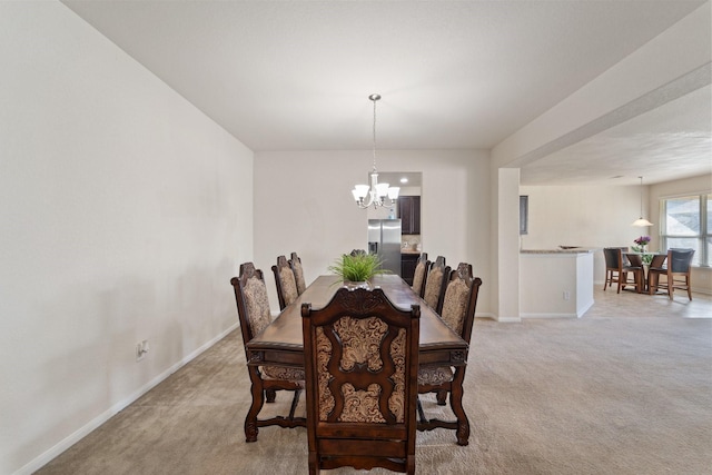 1902 Red Cedar Trl, Rosenberg, TX 77471 - dining area with baseboards, a chandelier, and light colored carpet