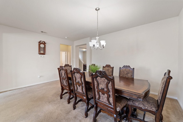 1902 Red Cedar Trl, Rosenberg, TX 77471 - dining room with baseboards, an inviting chandelier, and light colored carpet