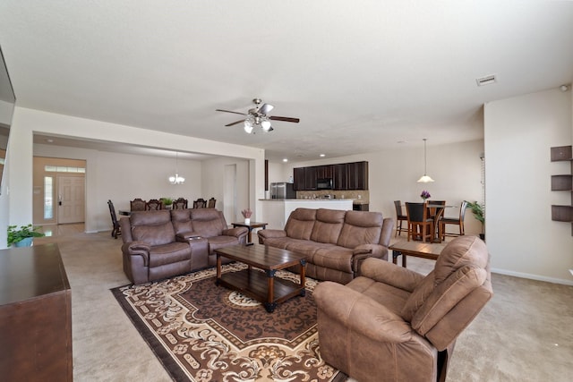 1902 Red Cedar Trl, Rosenberg, TX 77471 - living room featuring light carpet, baseboards, a ceiling fan, and visible vents
