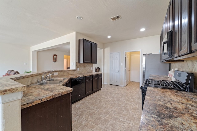 1902 Red Cedar Trl, Rosenberg, TX 77471 - kitchen featuring a sink, tasteful backsplash, black appliances, visible vents, and dark brown cabinets