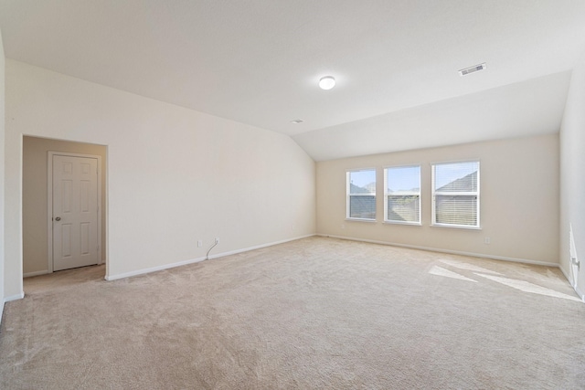 1902 Red Cedar Trl, Rosenberg, TX 77471 - empty room with vaulted ceiling, visible vents, baseboards, and light carpet