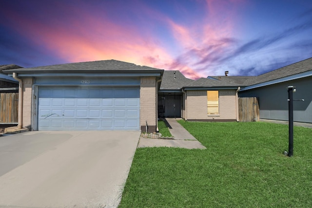 6230 Grandvale Dr, Houston, TX 77072 - single story home with a front lawn, driveway, brick siding, and a garage