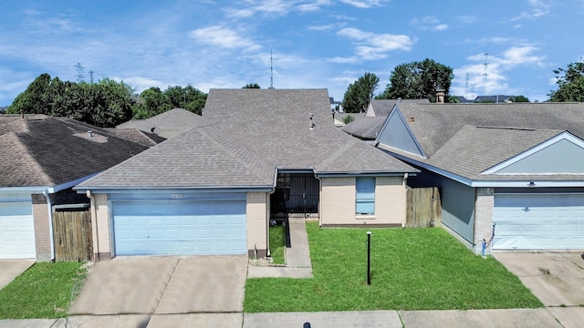 6230 Grandvale Dr, Houston, TX 77072 - view of front of home with brick siding, fence, a garage, concrete driveway, and a front lawn