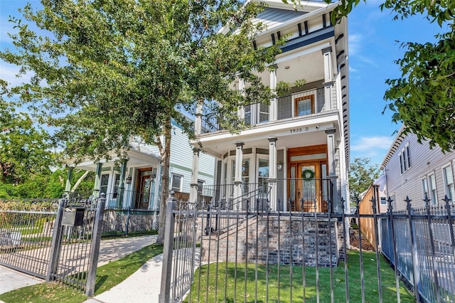 1905 W 14th St Unit B, Houston, TX 77008 - italianate house featuring stairs, a fenced front yard, covered porch, and a gate