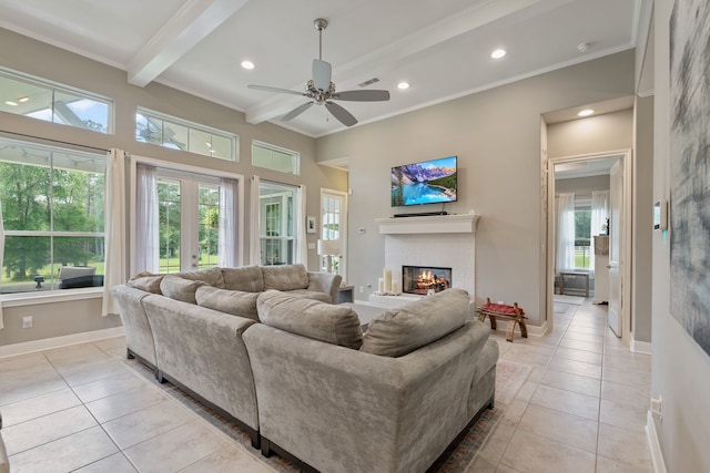 living room featuring light tile patterned flooring, a brick fireplace, beamed ceiling, and a ceiling fan