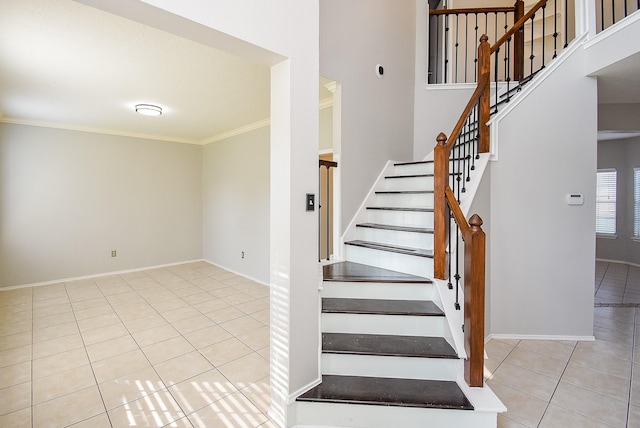 210 Needleleaf Ln, Sugar Land, TX 77479 - stairs with tile patterned floors, crown molding, baseboards, and a towering ceiling