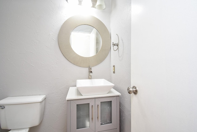 210 Needleleaf Ln, Sugar Land, TX 77479 - bathroom with vanity, a textured wall, and toilet