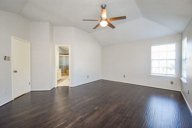 210 Needleleaf Ln, Sugar Land, TX 77479 - empty room featuring lofted ceiling, ceiling fan, and dark wood-style flooring
