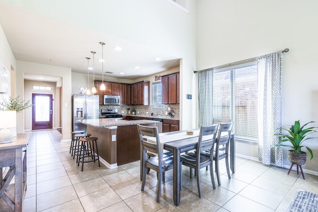 246 Bayside Crossing Dr, La Porte, TX 77571 - dining room featuring light tile patterned floors, baseboards, and recessed lighting