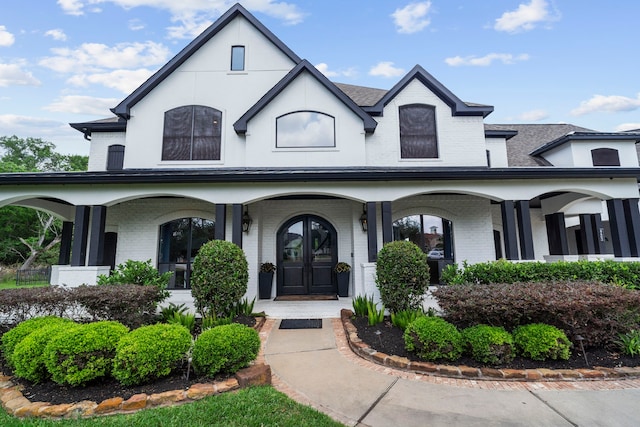 8603 Royal Retreat, Richmond, TX 77469 - entrance to property with a porch, brick siding, and a shingled roof