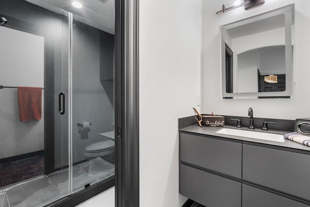 8603 Royal Retreat, Richmond, TX 77469 - bathroom featuring a stall shower, vanity, and toilet