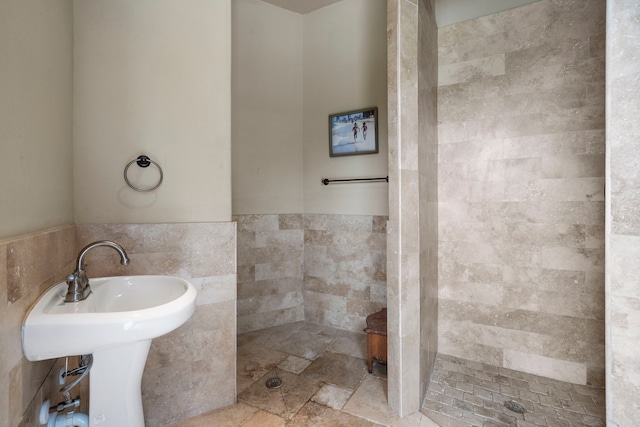 8603 Royal Retreat, Richmond, TX 77469 - full bath featuring tile walls, wainscoting, a tile shower, and a sink