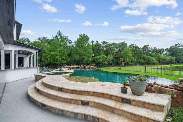 8603 Royal Retreat, Richmond, TX 77469 - view of swimming pool with a patio area, a pool with connected hot tub, and fence