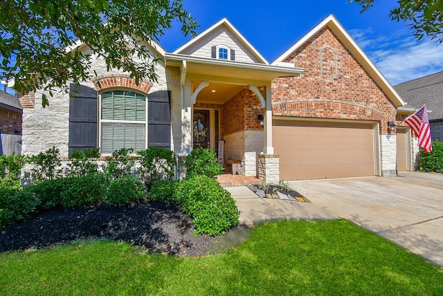 18273 Evanhale Bend Dr, Cypress, TX 77429 - view of front of home with an attached garage, driveway, brick siding, stone siding, and a front lawn