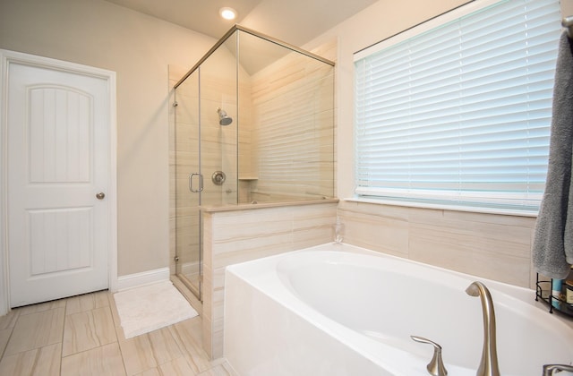 18273 Evanhale Bend Dr, Cypress, TX 77429 - bathroom featuring a stall shower, a garden tub, and healthy amount of natural light