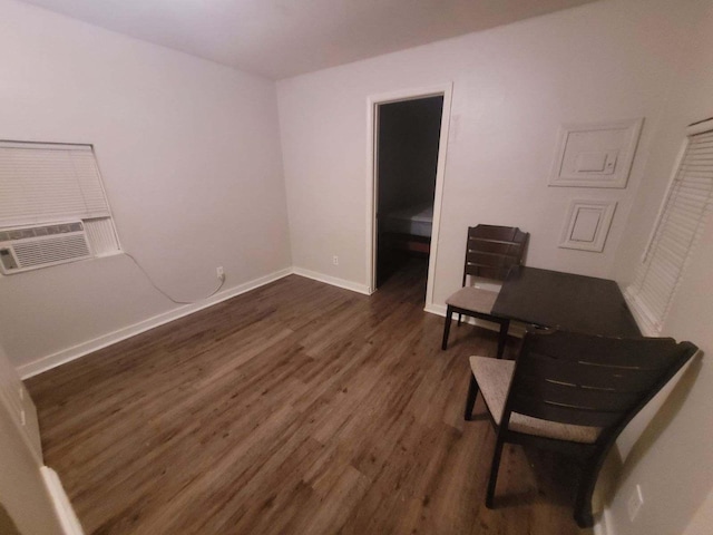 415 5th St, San Leon, TX 77539 - interior space featuring baseboards, cooling unit, and dark wood finished floors