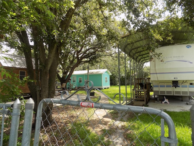 415 5th St, San Leon, TX 77539 - view of yard featuring a detached carport