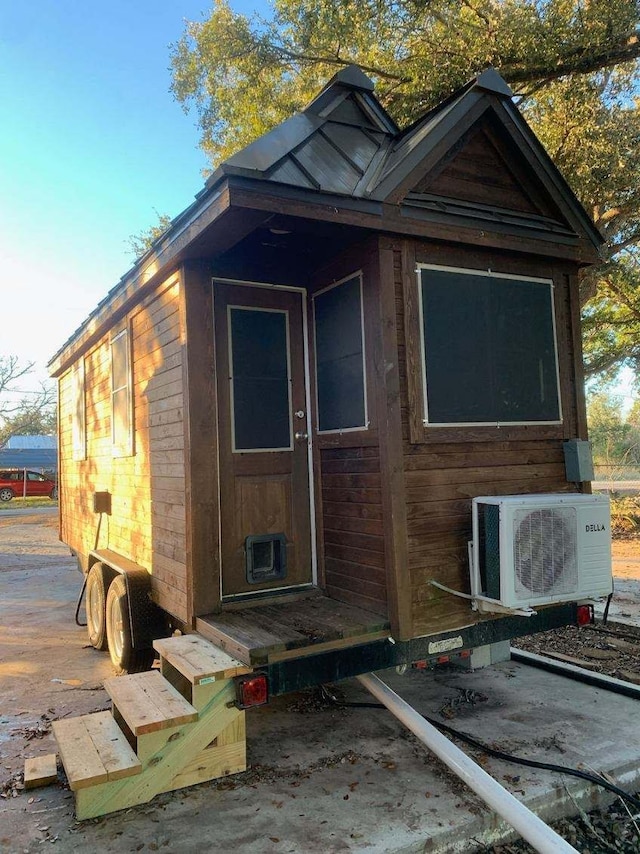 415 5th St, San Leon, TX 77539 - view of outdoor structure featuring entry steps and ac unit