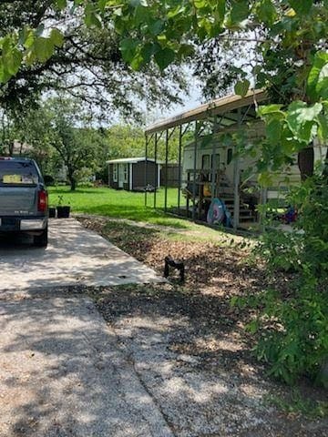 415 5th St, San Leon, TX 77539 - view of yard with an outbuilding